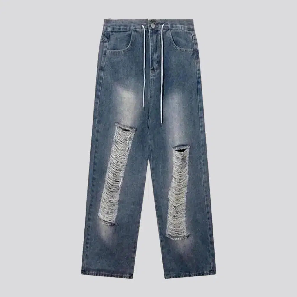 Medium-wash distressed jeans
 for men